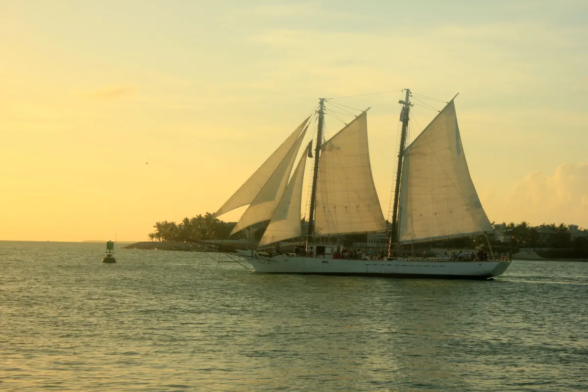Large schooner under full sail in golden evening light off Key West